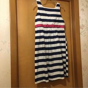 Girls navy and white striped dress with bright pink bow detail